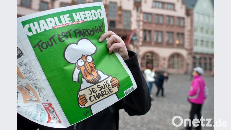Das erste Heft der französischen Satirezeitschrift "Charlie Hebdo" nach dem Attentat auf ihre Redaktion im Januar 2015. Bild: Boris Roessler/dpa