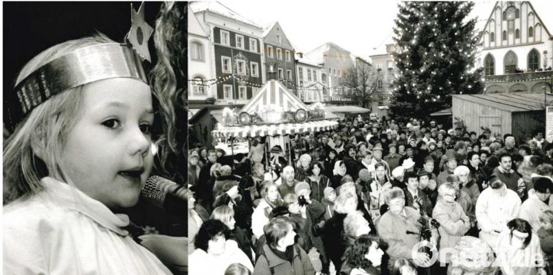 Blick ins Archiv der Amberger Zeitung vom 27. November 1998: Zur Eröffnung des Weihnachtsmarktes auf den Marktplatz scharten sich viele Menschen um die Bühne. Dort gab die sechsjährige Katharina Bauer als Christkindl verkleidet den offiziellen Startschuss. Archivbild: Wolfgang Steinbacher