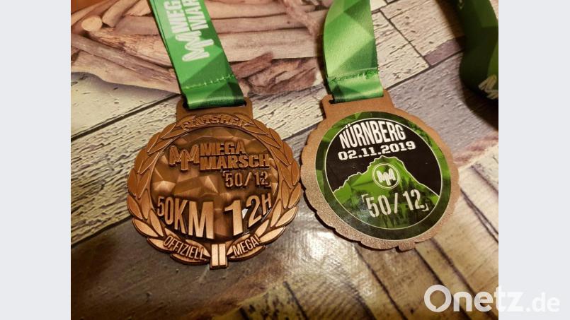 Nur wer durchs Ziel geht, bekommt die Medaille. Bild: exb/Anna Schlegel