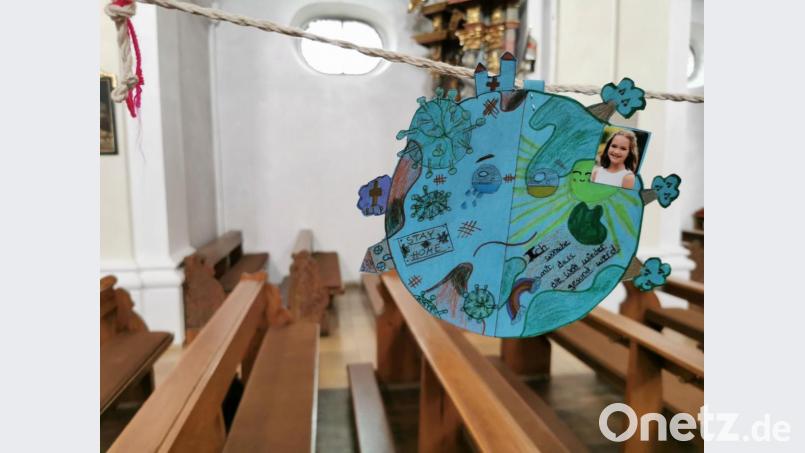 Eine junge Dame malte eine Weltkugel und wünschte, dass die Welt wieder gesund werde. Bild: gz