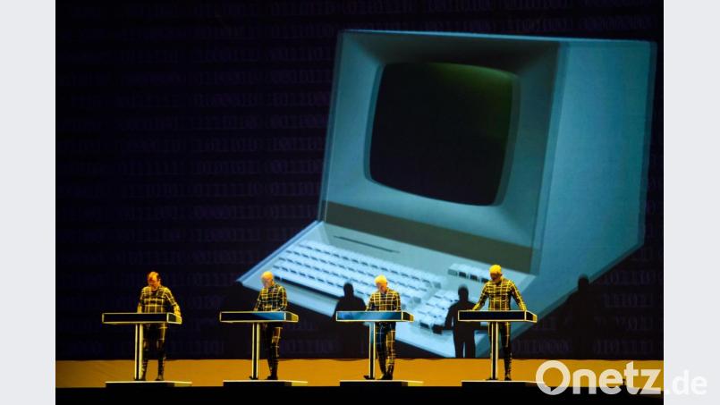 Die Mitglieder der Band Kraftwerk bei einem Konzert in Berlin im Jahr 2018. Bild: Gregor Fischer/dpa