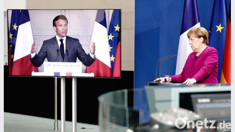Bundeskanzlerin Angela Merkel (CDU) und Frankreichs Präsident Emmanuel Macron, per Video zugeschaltet, geben nach einer gemeinsamen Videokonferenz eine Pressekonferenz. Ein Thema war die Corona-Pandemie und deren Folgen. Bild: Kay Nietfeld/dpa