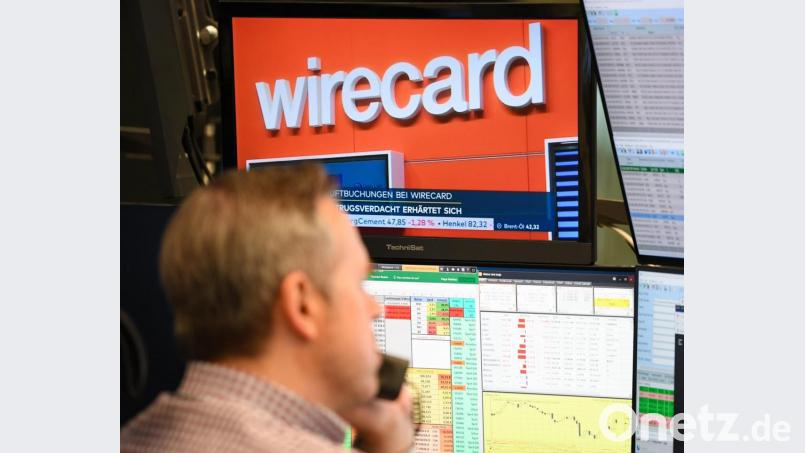 Auf dem Fernsehmonitor eines Aktienhändlers auf dem Parkett der Frankfurter Wertpapierbörse läuft die Nachricht, dass sich der Betrugsverdacht bei Bezahldienstleister Wirecard erhärtet. Bild: Arne Dedert/dpa