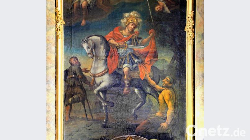 Das Bild der Mantelteilung am Hochaltar der Pfarrkirche St. Martin erinnert an die christliche Pflicht, mit notleidenden Menschen zu teilen. Bild: Josef Böhm