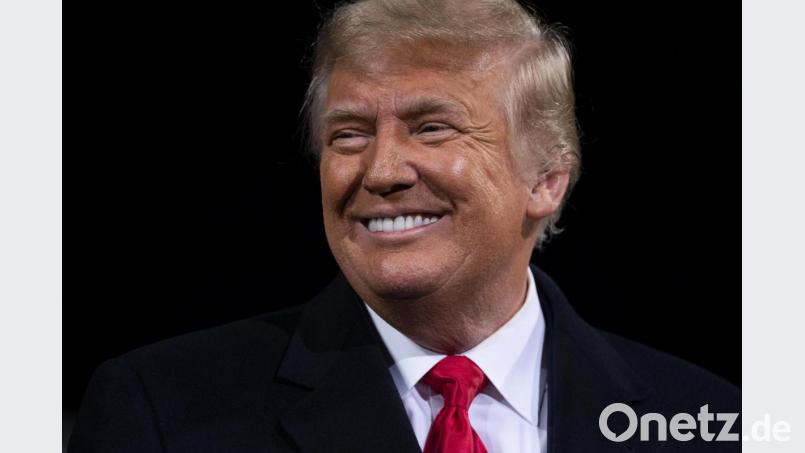US-Präsident Donald Trump lächelt bei einer Kundgebung für die Wiederwahl der beiden republikanischen Senatoren D. Perdue und K. Loeffler. Sie müssen sich am 5. Januar in Stichwahlen den Demokraten J. Ossoff und R. Warnock stellen. Bild: Evan Vucci