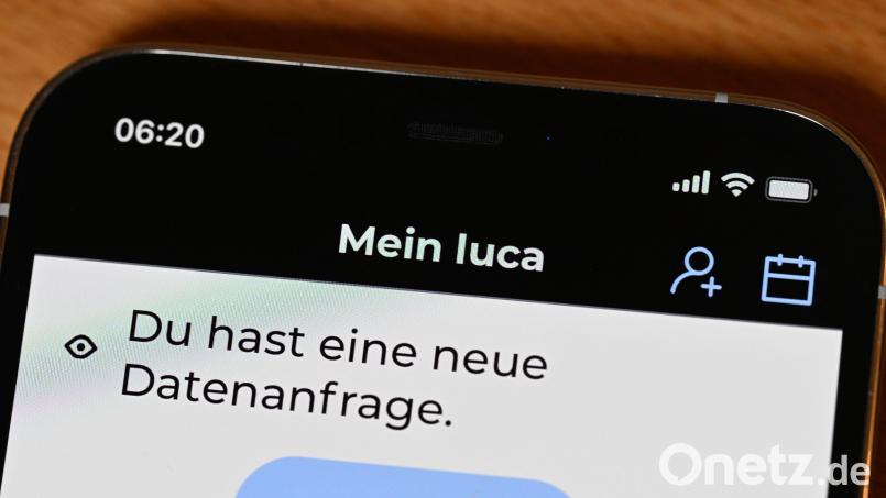 Die Startseite einer Luca-App ist auf einem Bildschirm eines Smartphones dargestellt. Foto: Bernd Weißbrod/dpa Bild: Bernd Weißbrod