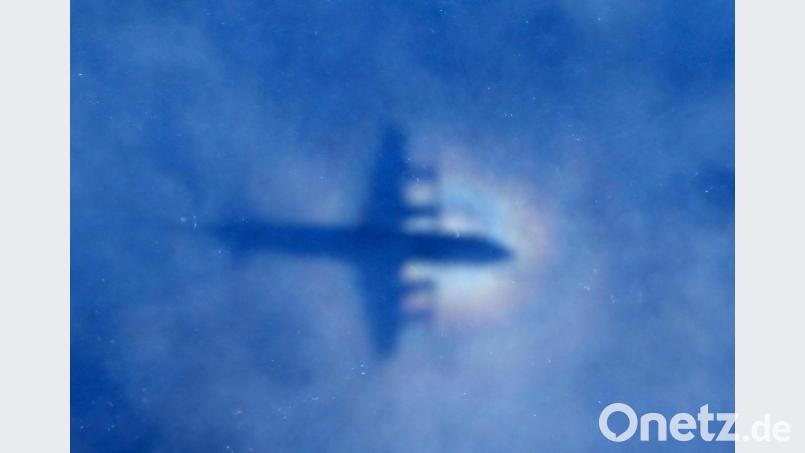 Eine Maschine der Royal New Zealand Air Force P3 Orion sucht nach der vermissten Maschine des Flugs MH370 der Malaysia Airlines. Bild: ROB GRIFFITH/EPA pool/dpa