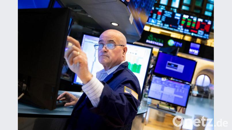 Ein Händler arbeitet an der New Yorker Börse. Bild: Allie Joseph/NYSE/XinHua/dpa
