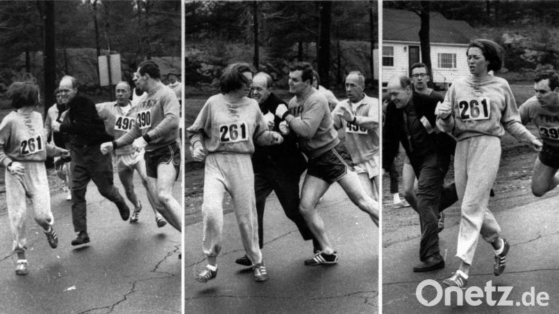 Kathrine Switzer beim Boston-Marathon 1967. Harry Trask hat die legendären drei Fotos geschossen, als Jock Semple versucht, Kathrin Switzer (Nummer 261) aus dem Rennen zu nehmen. Tom Miller (390) befördert ihn mit einem Bodycheck von der Straße. Mit im Bild ist auch Kathrines Trainer Arnie Briggs (490). Bild: Harry Trask, Boston Herald