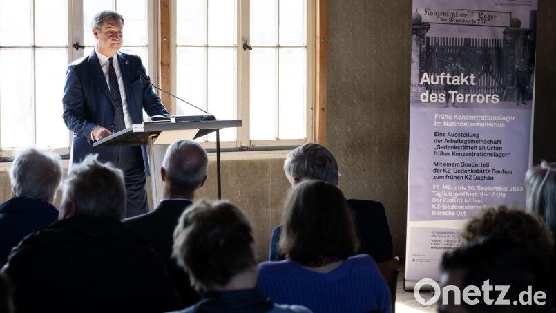 Markus Söder nimmt in der KZ-Gedenkstätte Dachau bei der Eröffnung der Ausstellung teil. Bild: Sven Hoppe/dpa