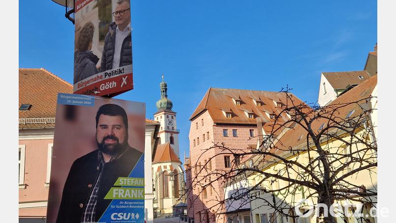 Stefan Frank (unteres Plakat) will Michael Göth im Rathaus ablösen. Doch gleichzeitig hat er den Amtsinhaber im Wahlkampf nur mit Samthandschuhen angefasst. Bild: Tobias Gräf