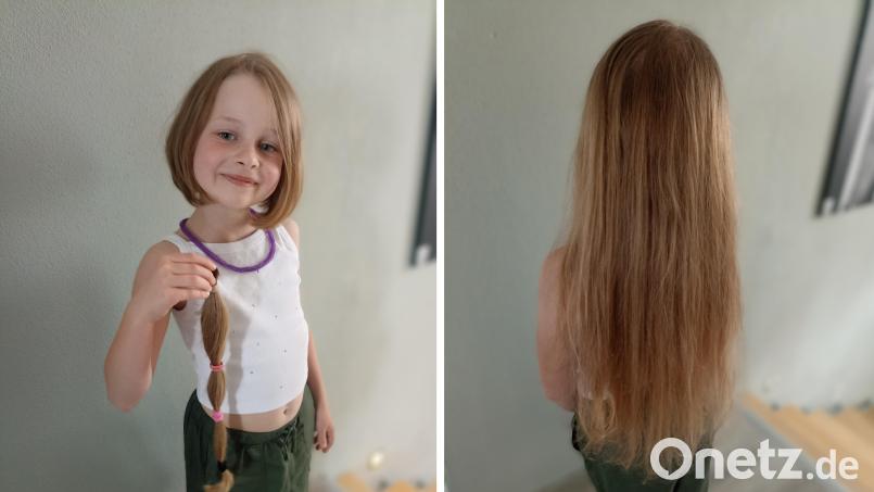Stolz präsentiert Amelie ihre Haarspende. 38 Zentimeter war der Zopf lang. Die Haare werden nun zu einer Perücke verarbeitet. Bild: Bauer