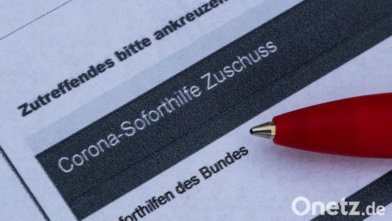 Etwa 25.000 Unternehmen und Selbständige müssen ihre erhaltenen Corona-Hilfen zurückzahlen. Symbolbild: Robert Michael/dpa