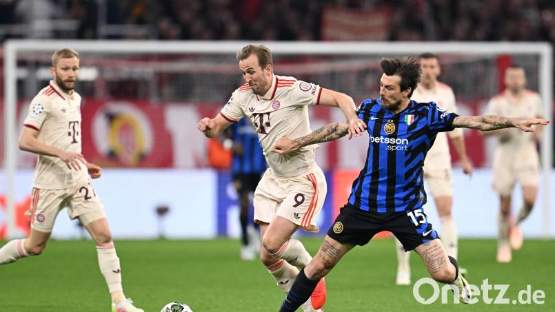 Bayern-Stürmer Harry Kane (Mitte) im Zweikampf mit Inters Francesco Acerbi (rechts). Bild: Sven Hoppe/dpa