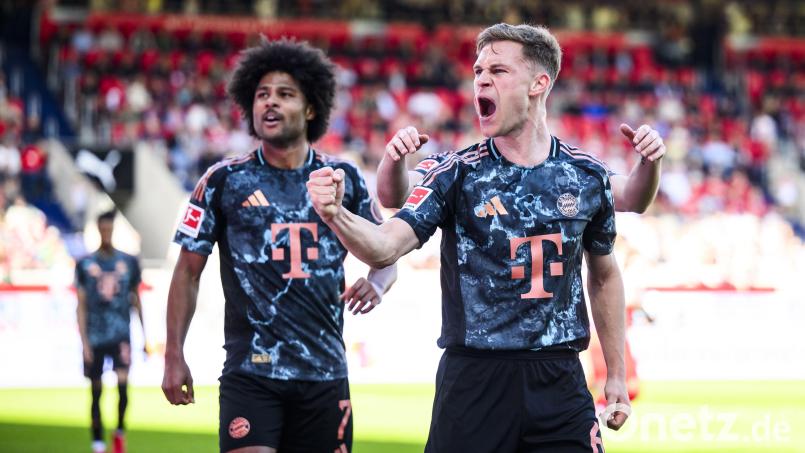 Joshua Kimmich (rechts) jubelt über sein Tor zum 4:0 gegen Heidenheim. Der Bayern-Kapitän war nach dem klaren Erfolg stolz auf die Mannschaft. Bild: Tom Weller/dpa