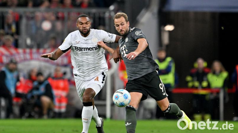 Künftig Mannschaftskameraden: Jonathan Tah (links) und Bayern-Stürmer Harry Kane. Archivbild: Peter Kneffel/dpa