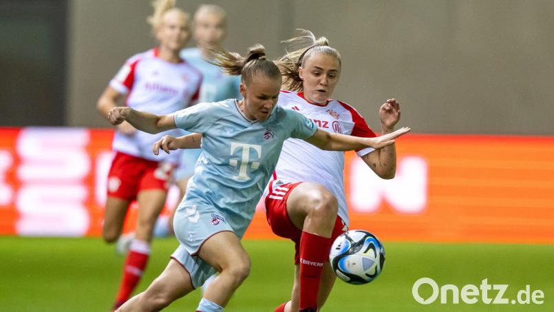 Laura Donhauser (li.) verlängert beim FC Köln. Archivbild: Peter Kneffel/dpa