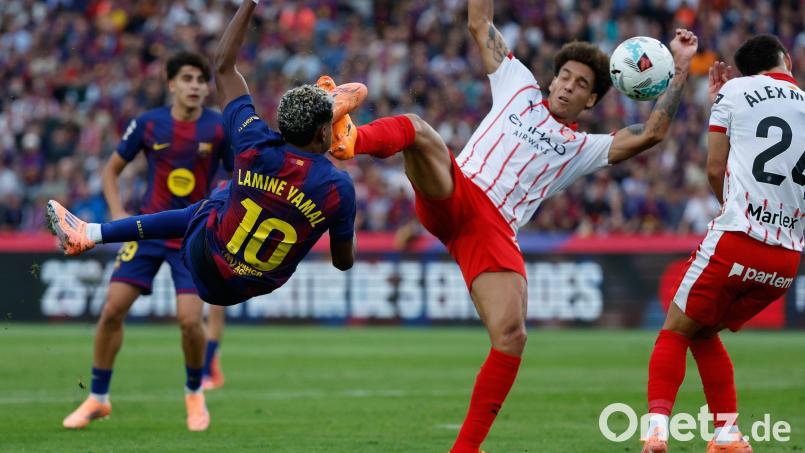 Barcelona mit Lamine Yamal (l) siegte gegen Girona mit dem früheren Dortmunder Axel Witsel. Bild: Joan Monfort/AP/dpa
