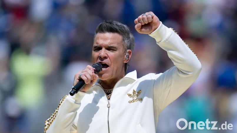 Sein einziges Deutschlandkonzert führt Robbie Williams 2026 nach Düsseldorf. (Archivbild) Bild: Sven Hoppe/dpa