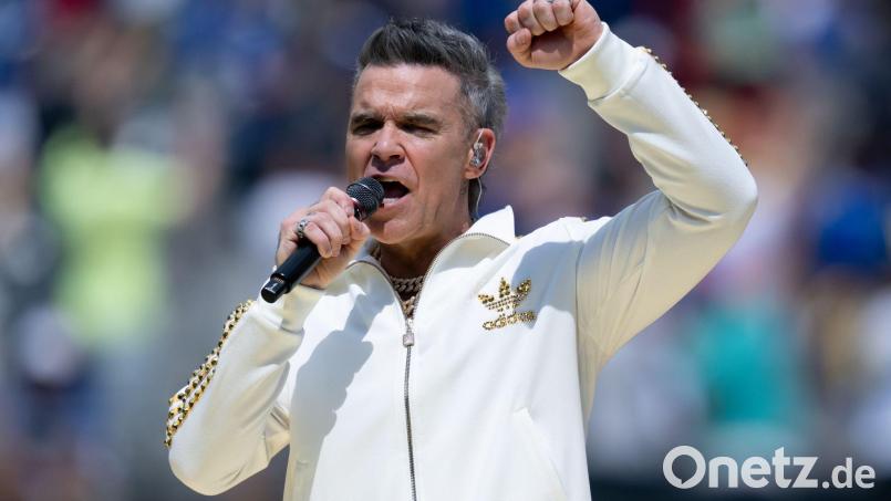 Robbie Williams überraschte seine Fans drei Wochen früher mit seinem neuen Album. (Archivbild) Bild: Sven Hoppe/dpa