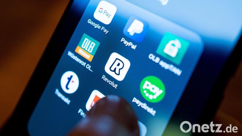 Die britische Digitalbank Revolut expandiert auf den hart umkämpften US-amerikanischen Bankenmarkt. (Symbolbild). Bild: Monika Skolimowska/dpa-Zentralbild/dpa