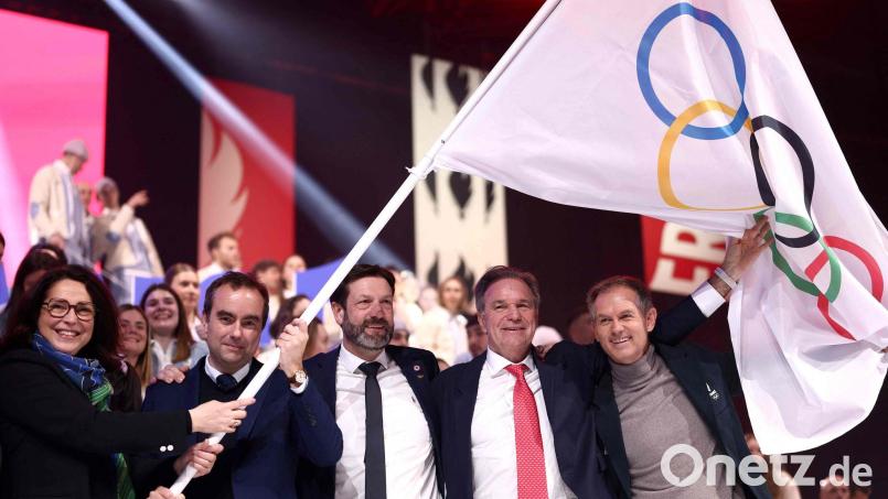 Vier Jahre vor den Olympischen Winterspielen in Frankreich gibt es Streit um den Austragungsort für Eishockey. Bild: Alex Martin/AFP/dpa