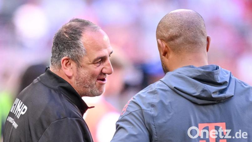 Schätzen sich: Heidenheims Frank Schmidt und Vincent Kompany von den Bayern. Bild: Harry Langer/dpa