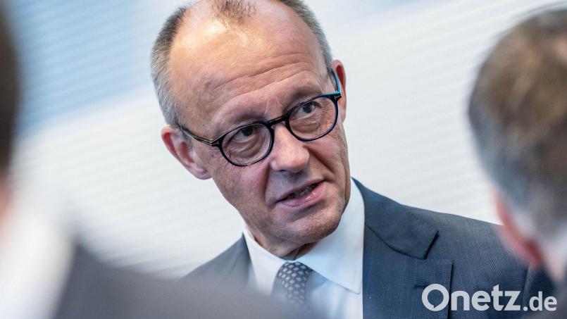Merz weist die SPD-Vorwürfe erneut zurück. Bild: Michael Kappeler/dpa