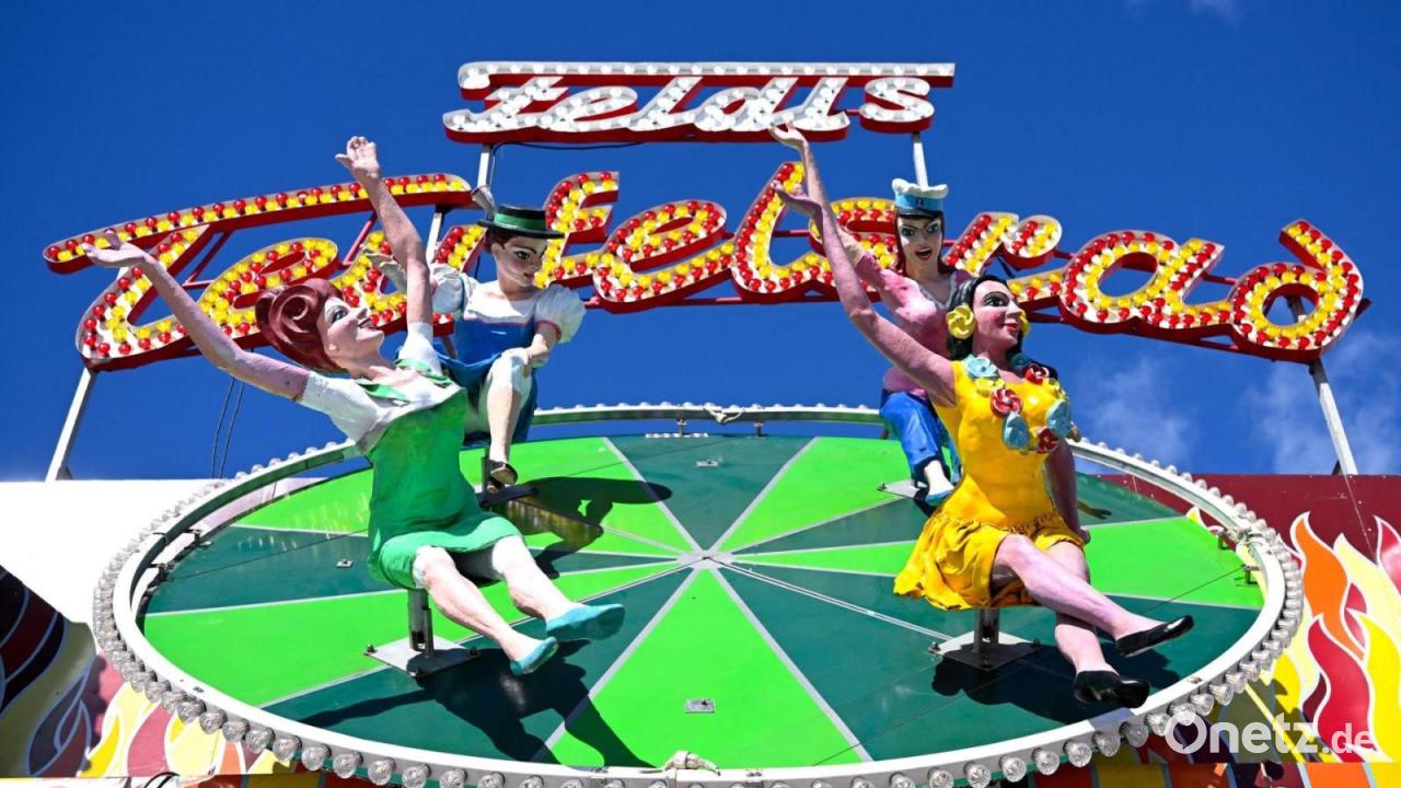 „Teufelsrad“ umgestaltet - Debatte um Wiesn-Figur mit Schuh