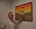 Bild: inl
Adolf Ritz vor seinem Wimmelbild "Deutschlands 90er". Im Vordergrund deutet er auf Helmut Kohl und Hans-Dietrich Genscher.