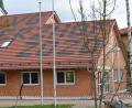 Bild: frd
Auf dem Dach des Dorfgemeinschaftshauses ist von der vorbeiführenden Straße aus zu lesen, was die „Vereinsgemeinschaft (VG) Berzhof“ im Jahr 2020 zum Abschluss bringen wird.