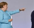 Bild: John Macdougall/dpa
Bundeskanzlerin Angela Merkel (CDU) und Bundesfinanzminister Olaf Scholz (SPD) verlassen eine Pressekonferenz im Bundeskanzleramt.