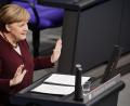 Bild: Michael Kappeler/dpa
Bundeskanzlerin Angela Merkel (CDU) spricht im Bundestag.