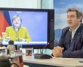Bild: Peter Kneffel/dpa
Ministerpräsident Markus Söder und Angela Merkel haben sich per Videokonferenz mit den bayerischen Landräten und Oberbürgermeistern ausgetauscht.