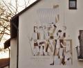 Bild: Mardanow
Das Sgraffito am alten AOK-Gebäude zeigt Pfarrer Florian von Miller (mit Schwert und Standarte) an der Spitze der Aufständischen. Die Tage von Gebäude und Bildnis sind nunmehr gezählt.