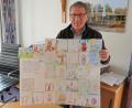 Bild: bsc
Bürgermeister Oskar Schuster strahlt angesichts der Osterbilder der Friedenfelser Grundschüler. Er fertigte daraus ein großes Osterposter für den Schaukasten der Gemeinde.