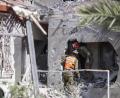 Bild:  Ilia Yefimovich/dpa
Rettungskräfte inspizieren ein beschädigtes Gebäude in der israelischen Stadt Aschkelon, nachdem es von Raketen getroffen wurde, die aus dem Gazastreifen abgefeuert wurden.