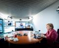 Bild: Steffen Kugler/Bundesregierung/dpa
Bundeskanzlerin Angela Merkel (CDU) nimmt gemeinsam mit Michael Müller (SPD), Regierender Bürgermeister von Berlin, an einer Videokonferenz mit den Ministerpräsidentinnen und Ministerpräsidenten der Länder zum Thema Impfen teil.