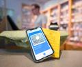 Symbolbild: Oliver Dietze
Ein Smartphone mit dem QR-Code eines digitalen Impfausweises liegt zusammen mit einem Impfbuch auf dem Tisch einer Apotheke.