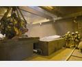 Bild: ga
Mit schwerem Atemschutz und mit Schaumrohr waren die Feuerwehrler im Müllbunker zugange.