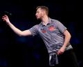 Bild: John Walton/PA Wire/dpa
Darts-Ass Florian Hempel in Aktion.