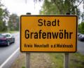 Bild: Daniel Karmann/dpa/Archivbild
"Stadt Grafenwöhr" steht auf einem Ortsschild.