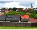 Archivbild: sche
Der hochwassergefährdete Weiler Greßmühle (im Vordergrund) bekommt zweit Rückhaltedämme für Niederschlagswasser, um Überschwemmungen der Wohnhäuser zu verhindern.