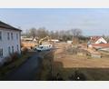 Bild: rha
Vom ersten Stock des BRK-Seniorenheims in Vilseck geht der Blick hinunter auf die große Baustelle, wo in etwa zwei Jahren das neue Seniorenquartier St. Ägidius eröffnet werden soll.