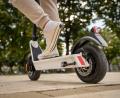 Symbolbild: Miljan Zivkovic - stock.adobe.com
Feet of unknown man standing by or driving electric kick scooter e-scooter on the pavement in day eco friendly modern transport