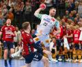 Bild: Michael Hundt/dpa
Lukas Mertens und die Bundesliga-Handballer des SC Magdeburg lösten die Pflichtaufgabe bei GWD Minden souverän.
