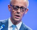 Bild: Michael Kappeler/dpa
Der Kanzler bekennt sich am Vorabend des Regierungs-Jahrestags zur Zusammenarbeit mit der SPD.