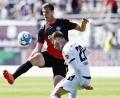 Archivbild: Uwe Anspach/dpa
Seit eineinhalb Jahren war Patrick Erras (links) für die Kieler nicht mehr am Ball.