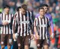 Bild: Philipp Szyza/dpa
Hauke Wahl (M.) und Teamkollegen auf der Bundesliga-Abschiedsrunde.