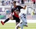 Bild: Uwe Anspach/dpa
Patrick Erras (links) im Trikot von Holstein Kiel im Spiel gegen den SV Sandhausen.